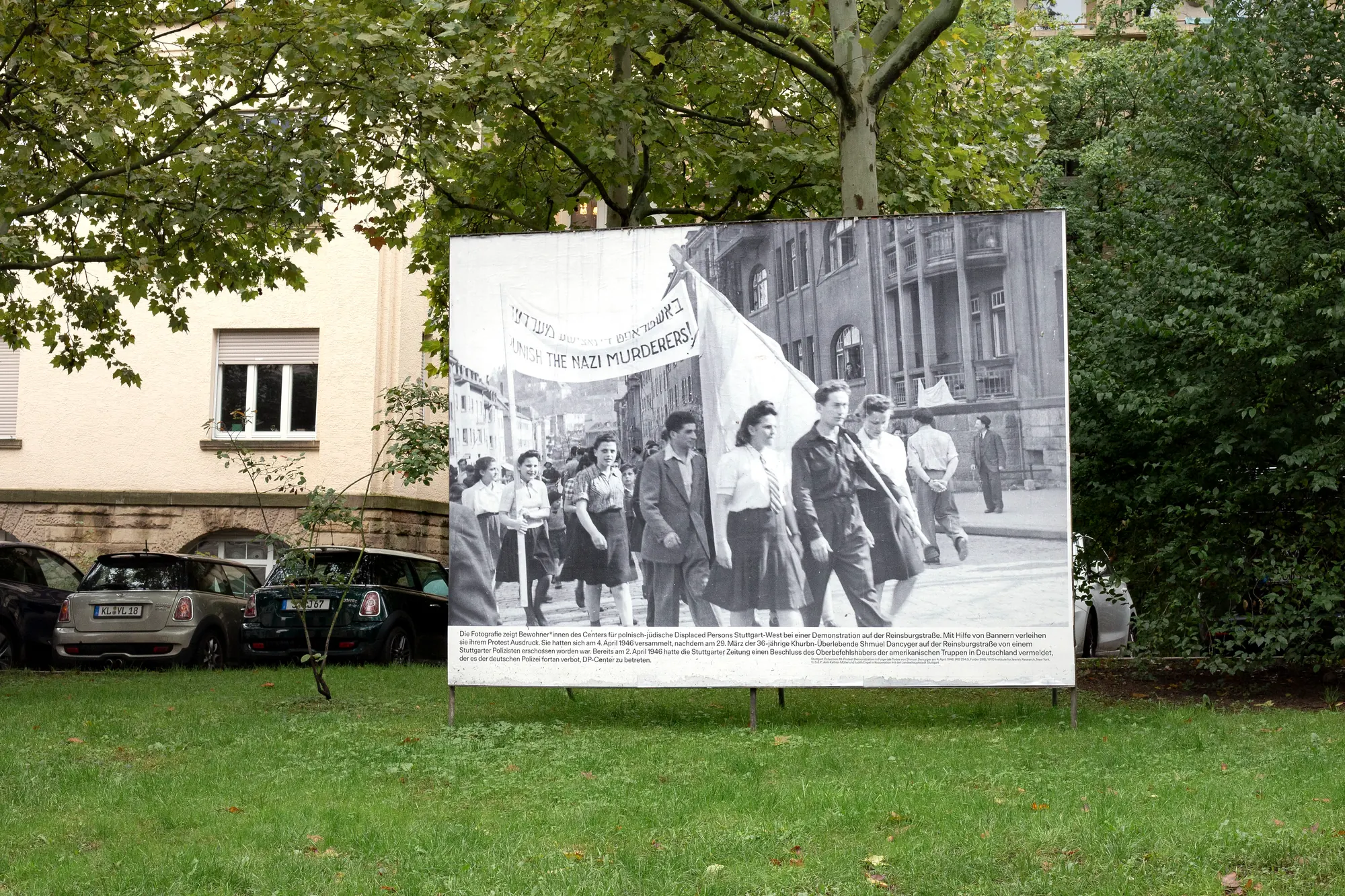 Billboard on Shmuel-Dancyger-Platz in Stuttgart showing a photograph of a demonstration by Jewish Displaced Persons, 1946